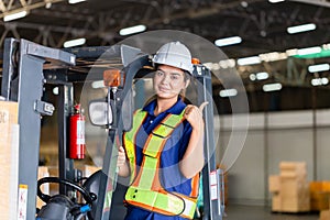 Cheerful female worker on forklift, Manual workers working in warehouse, Worker driver at warehouse forklift loader works