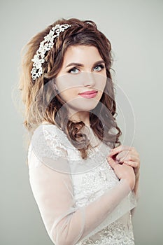 Cheerful fiancee woman. Happy bride with makeup and bridal hair