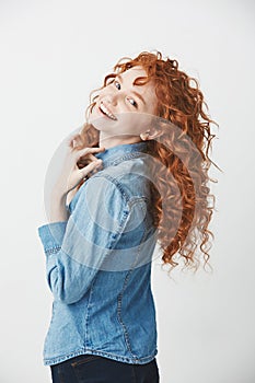 Cheerful foxy beautiful girl smiling laughing rejoicing looking at camera over white background.