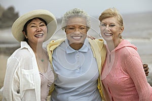 Cheerful Friends Enjoying Vacation At Beach