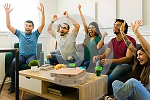 Cheerful friends shouting after the national team victory