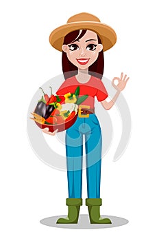 Cheerful gardener woman rancher holding basket with vegetables.