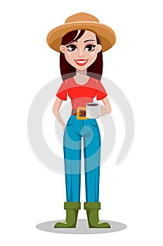 Cheerful gardener woman rancher holding a cup of coffee.