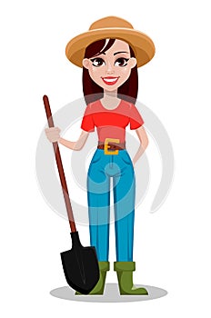 Cheerful gardener woman rancher holding a shovel.