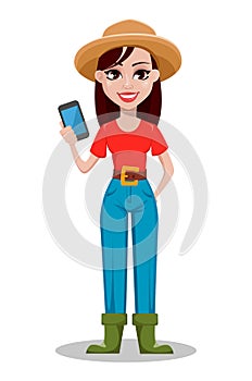 Cheerful gardener woman rancher holding smartphone.