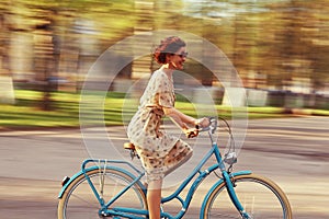 Cheerful girl on a bicycle