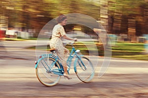 Cheerful girl on a bicycle