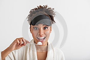 Cheerful girl cleaning teeth with joy photo