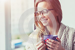 Cheerful girl drinking coffee