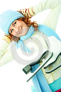 Cheerful girl goes ice-skating