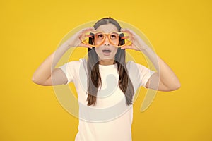 Cheerful girl In large bif funny party glasses sunglasses. Portrait of young woman wearing funny glasses isolated on