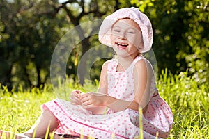 Cheerful girl laughing in the summer dress