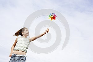 Cheerful Girl Playing With Pinwheel