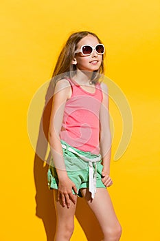 Cheerful girl posing in the sunlight