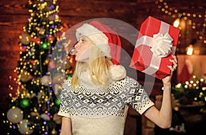 cheerful girl red santa hat. celebrate new year at home. last preparation. Christmas time. xmas holiday gift. Holiday