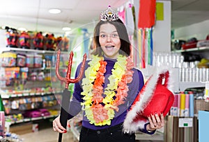 cheerful girl showing festival things in store