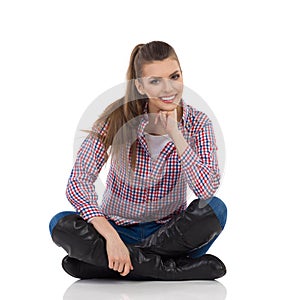 Cheerful Girl Sitting With Legs Crossed