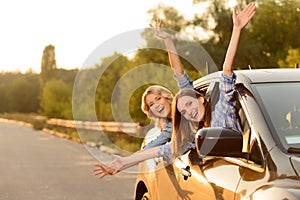 Cheerful girls sitting in the car