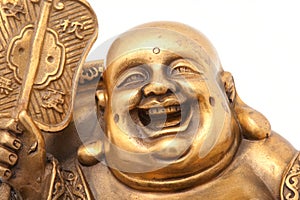 Cheerful Golden Hotei. Close-up photo