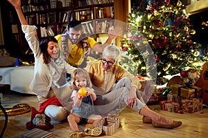 Cheerful grandmather and her family together for Christmas