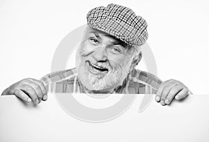 Cheerful grandpa. job search. Need help. wanted. Copy space placate information. happy mature man in retro hat