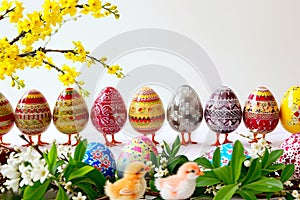 A cheerful graphic depicting Easter eggs with chicken legs.