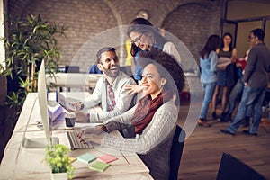 Cheerful group working in office