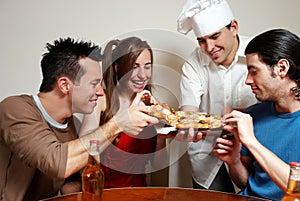 Cheerful group of youth in a pizza