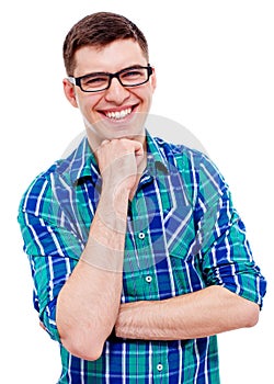 Cheerful guy in glasses with hand near chin