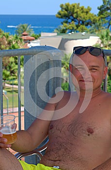 Cheerful guy resting at a Turkish resort