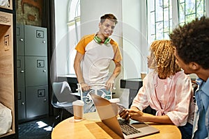 cheerful guy talking to african american