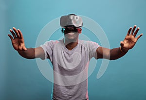 Cheerful guy wearing vr goggles with video interaction