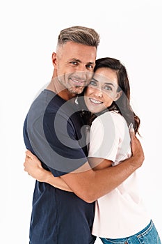 Cheerful happy adult loving couple isolated over white wall background