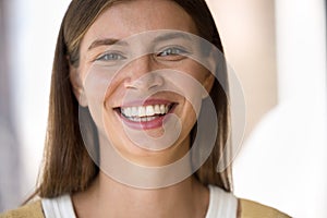 Cheerful happy beautiful young woman looking at camera