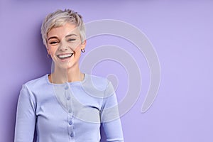 Cheerful happy woman with short hair laughing, feeling happiness, have fun