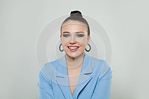 Cheerful happy young beautiful woman looking at camera smiling laughing over white background