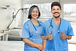 Cheerful hispanic male and female doctors