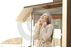 Cheerful hotel guest breathing fresh air