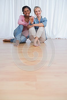 Cheerful housemates showing their new house keys