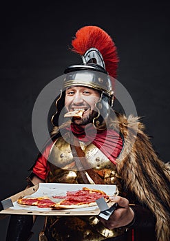 Cheerful imperial soldier with fur eating pizza