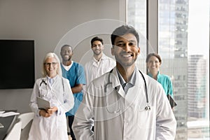 Cheerful Indian medical business leader man posing for professional portrait