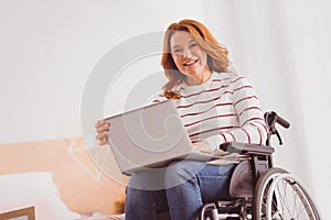 Cheerful invalid woman that working as freelancer