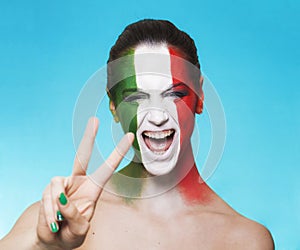 Cheerful italian supporter for FIFA 2014 gesturing