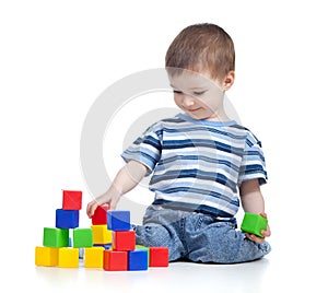 Cheerful kid boy with construction set