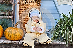 Cheerful kid, boy, at the pumpkin farm fair