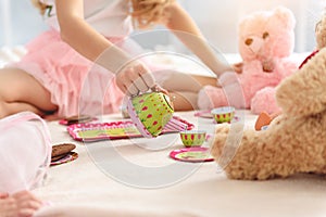 Cheerful kids having bun-fight with toys