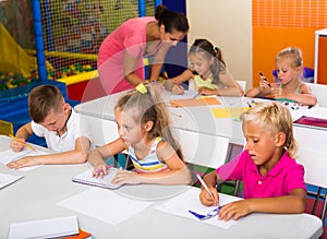 Cheerful kids at school lesson