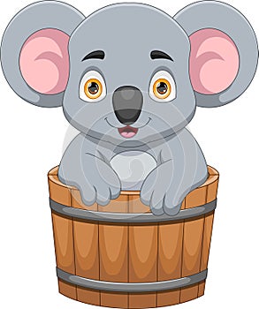 Cheerful koala in a wooden bucket cartoon