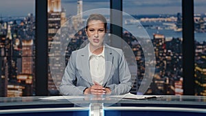 Cheerful lady announcer talking news at studio closeup. Woman ending broadcast