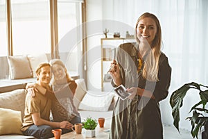 Cheerful lady telling about her pregnancy to future parents